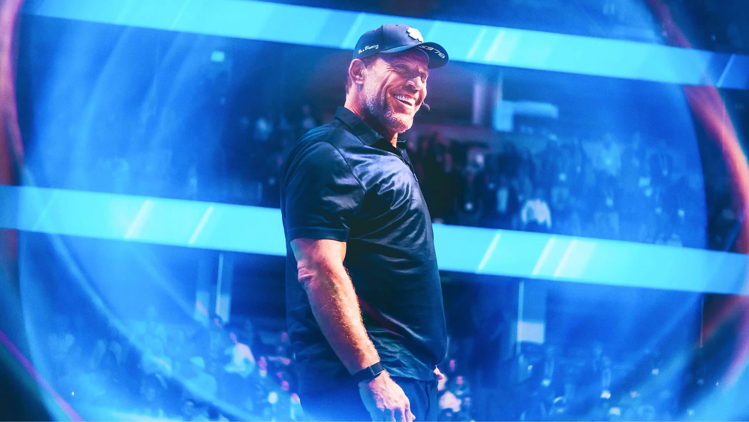 Tony Robbins on stage during a global business event